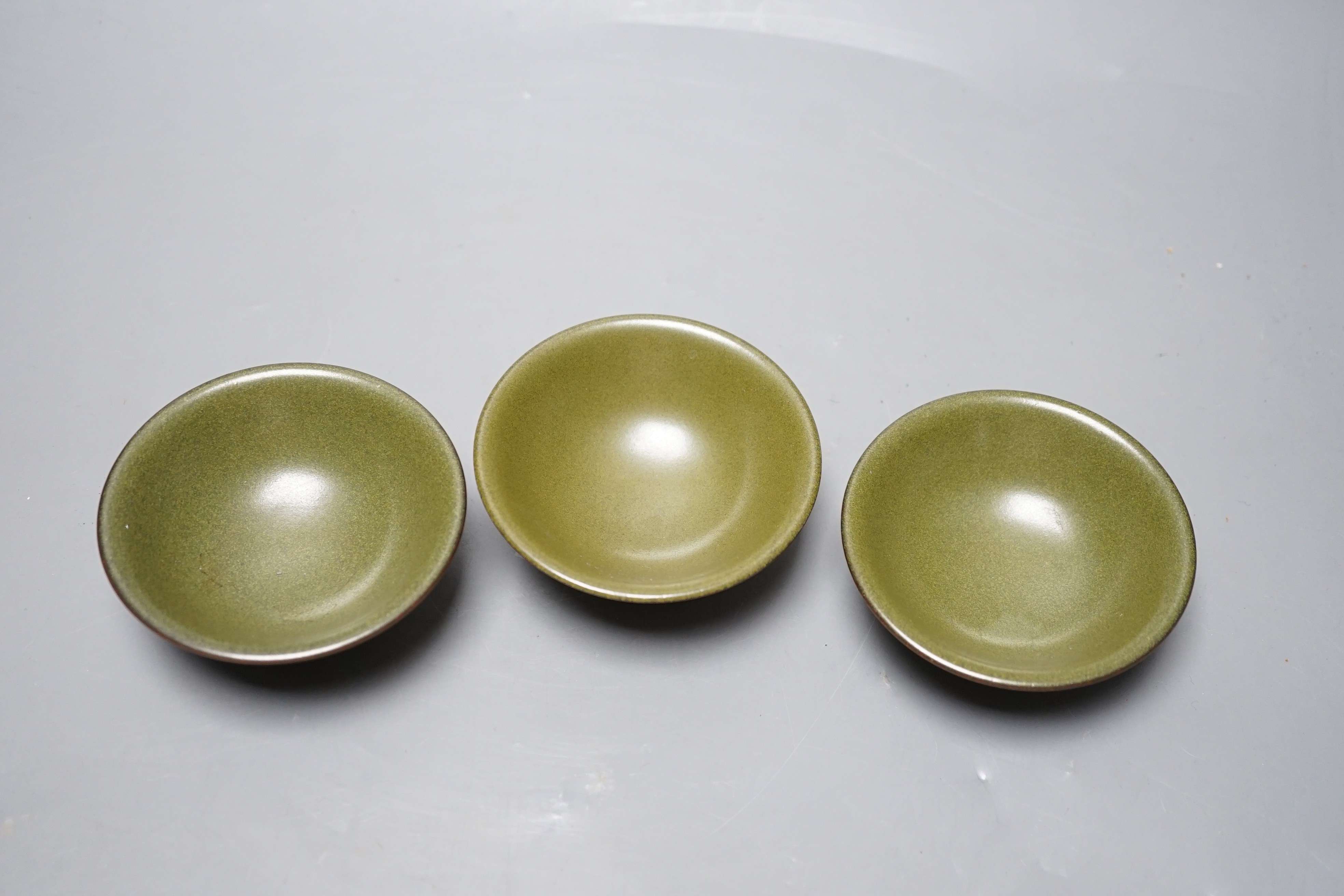 Three Chinese teadust glazed dishes, 8.5cm diameter